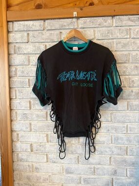 VINTAGE 80’s TEARWEAR cut loose Black Tee with Teal Graphic, Fringe & Side Ties
